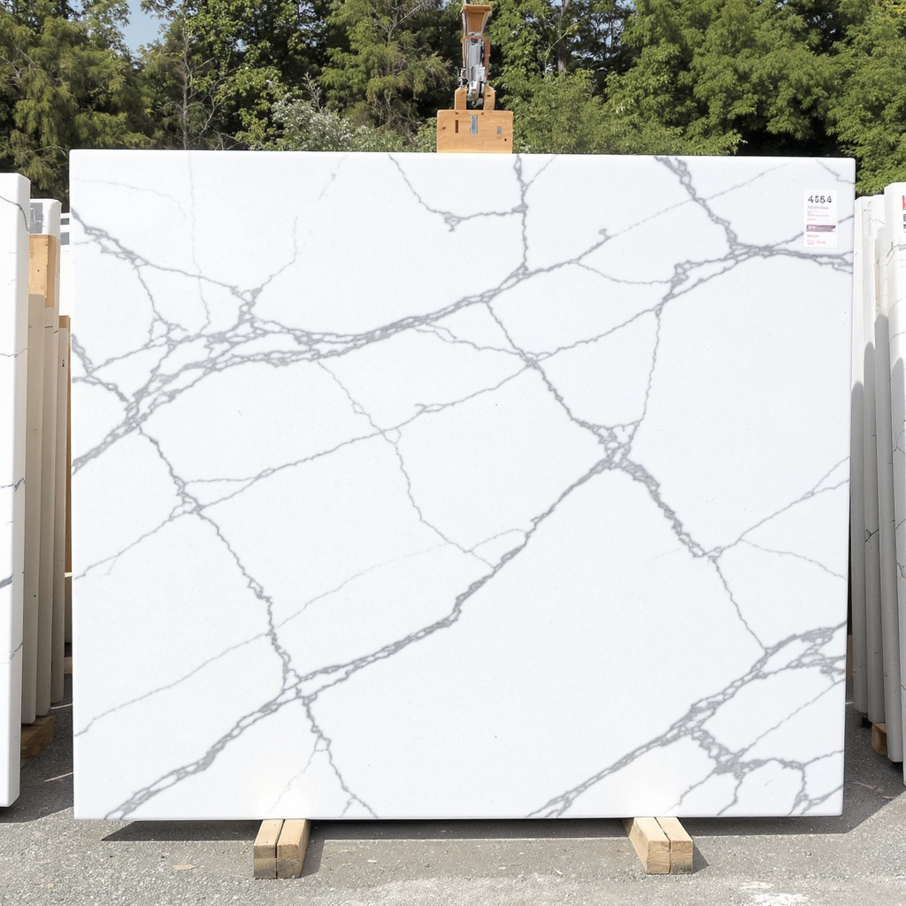 Carrara marble slab with soft grey veining on a white background, the most common natural marble in Lake Norman bathroom and accent-surface installs
